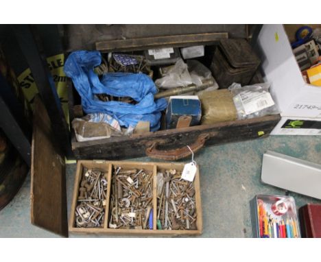 Vintage toolbox containing nails and screws