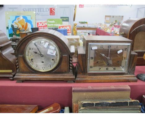 1930's Oak Mantel Clock with a domed top, circular dial, barley twist supports, and stepped base, together with a 1920's oak 