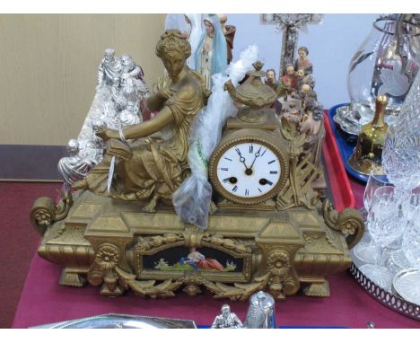 A Late XIX Century Mantel Clock, the gilt metal case of elaborate rectangular form with a seated lady holding a book, the whi
