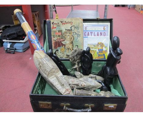 A Leather Suitcase, holding a collection of Aboriginal Art wooden figures and masks, a bamboo rain stick 80cm and 'Louis Wain