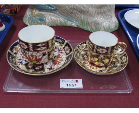 Royal Crown Derby imari pattern coffee can and saucer together with a Royal Crown Derby cup and saucer 2451 pattern number. (