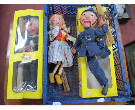 Three Pelham Puppets, Policeman, School teacher, and one other puppet:- One Basket.