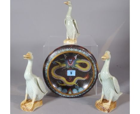 A 20th century cloisonné bowl with a dragon and three ceramic ducks, (4). 