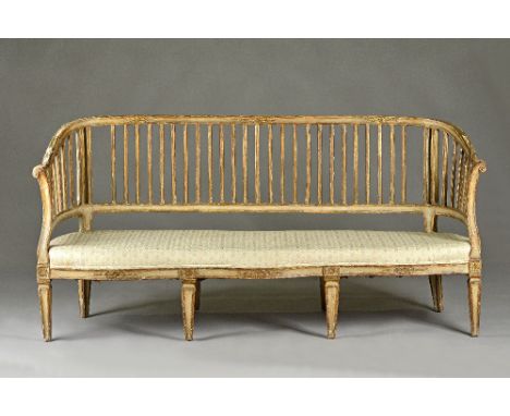 A late 18th century Italian polychrome painted pine slat back sofa with double serpentine seat, on tapering square supports, 