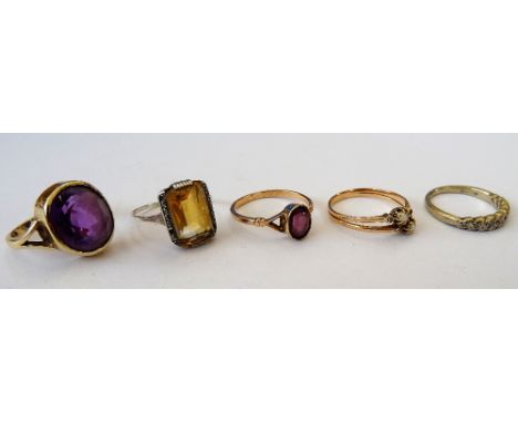 A 9ct gold ring, collet set with an oval cut amethyst, a citrine and marcasite set ring, an 18ct white gold and diamond set h