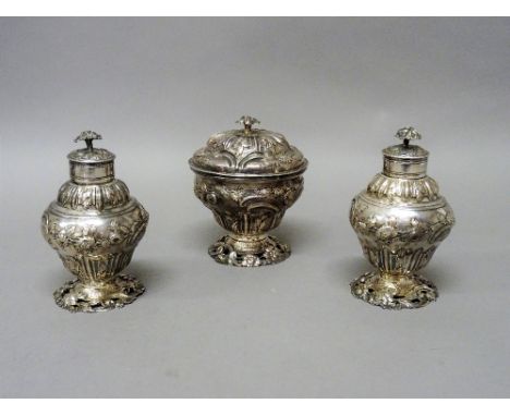 A late George II silver sugar box and cover and a matching pair of late George II silver tea caddies, each of baluster form w