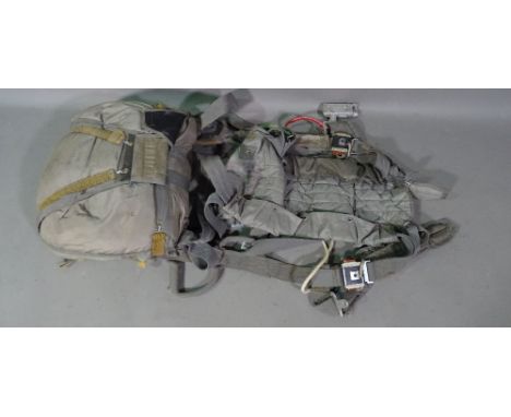A mid-20th century parachute in bag. This item is sold as a decorative piece. 