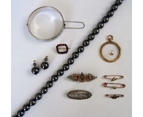 A Bohemian garnet set brooch, in an openwork rectangular design, three gem set lace pins, two silver brooches, a 9ct gold mou