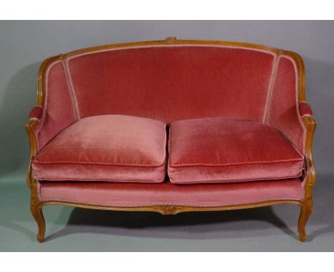 A Louis XVI style saloon suite comprising two armchairs and a sofa with pink upholstery, 130cm wide, (3). 