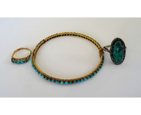 An 18ct gold and turquoise set five stone ring, Chester 1908, a turquoise matrix and marcasite set oval ring and a turquoise 