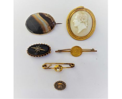 A gold mounted oval shell cameo brooch, carved as the portrait of a gentleman, detailed BANKES within a serpentine surround, 