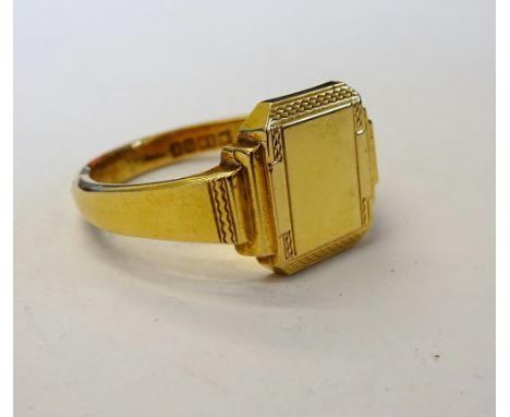 A gentleman's 18ct gold signet ring, of cut cornered rectangular form, partially engine turned, Birmingham 1958, weight 8.3 g