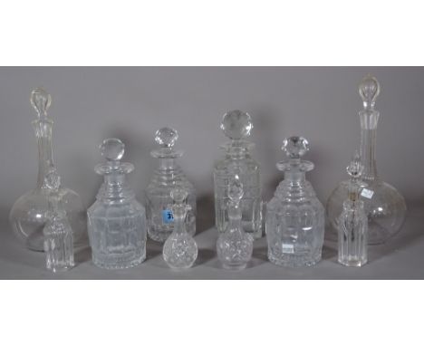 Three glass spirit decanters and stoppers, a pair of globe and shaft decanters and stoppers, a square decanter and stopper an