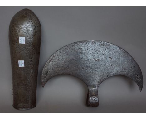 A Persian steel battle axe head of crescent form, engraved with Islamic script, 32.5cm wide and a Persian steel forearm armou