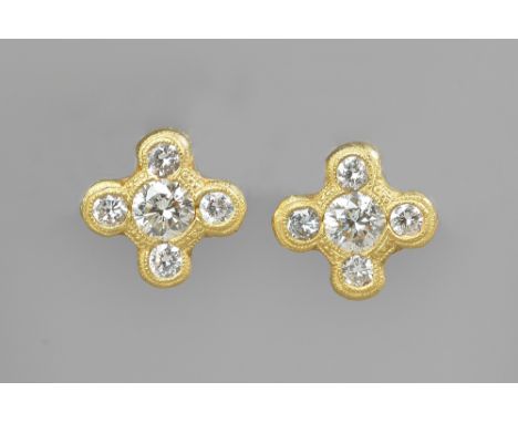 A pair of gold and diamond set five stone earstuds, each mounted with the principal circular cut diamond to the centre, in a 