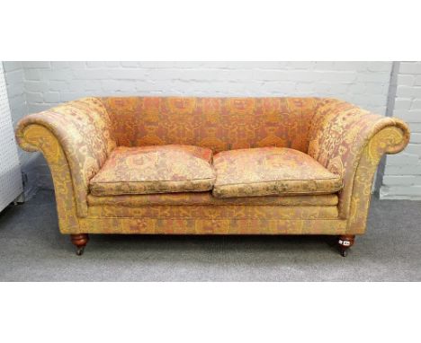 Mulberry; a Chesterfield style sofa, with heraldic upholstery on turned supports, 190cm wide x 77cm high.