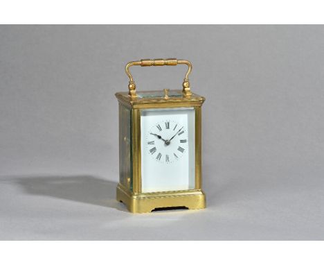 A French brass cased carriage clock by Couilliant, circa 1880, push button, repeat strike, with visible escapement, two train