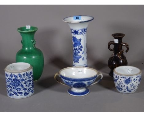 A group of Chinese blue and white porcelain, 18th/ 19th century, comprising; a Kangxi beaker vase painted with vases of flowe