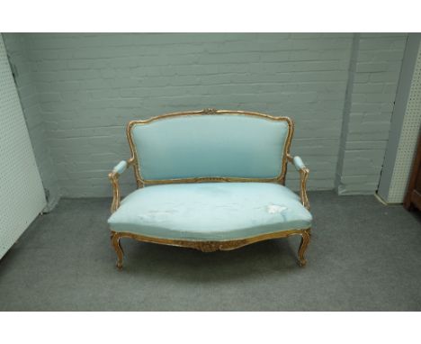 A 19th century French gilt framed sofa /canape with serpentine seat on scroll supports, 123cm wide x 90cm high.