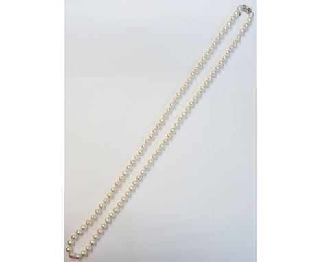 A single row necklace of uniform cultured pearls by Mikimoto, the ninety-five cultured pearls approximately 8.5mm - 9.0mm dia