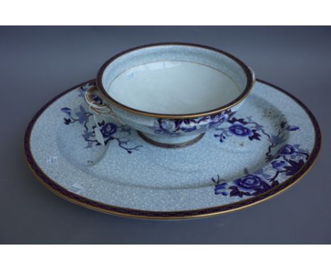 A Royal Worcester earthenware part dinner service, circa 1880, decorated with blue flowering branches picked out in gilding a