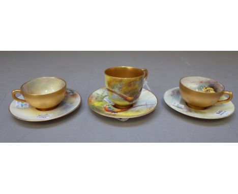 Three Royal Worcester small cups and saucers, circa 1915-18, one painted by James Stinton with sheep in a landscape; another 