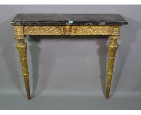 An 18th century style console table with serpentine faux marble top over gilt painted base, 124cm wide x 84cm high x 69cm dee