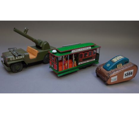 A Marx tinplate 'Turnover Tank', a Japanese K Toys Rocket Launcher jeep and another tinplate model 'San Francisco' cable car,