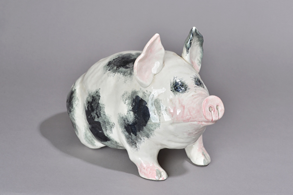 A large Wemyss pottery pig, early 20th century, modelled seated on its ...