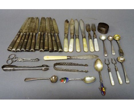 Silver and silver mounted wares, comprising; twelve knives, with silver blades and loaded silver handles, four fish knives an