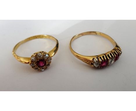 An 18ct gold, ruby and diamond cluster ring, claw set with a cushion shaped ruby in a surround of eight cushion shaped diamon