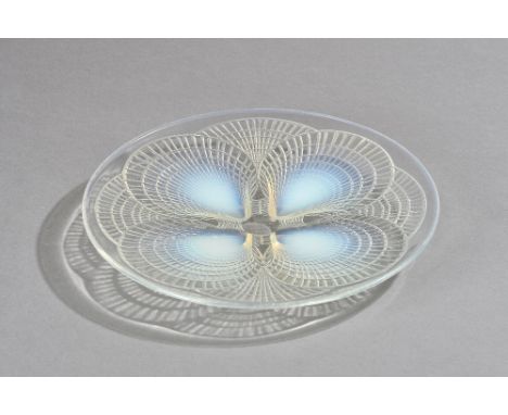 A Lalique 'Coquilles' opalescent glass plate, wheel engraved 'R. LALIQUE FRANCE'. 26.8cm diameter.  Illustrated. 