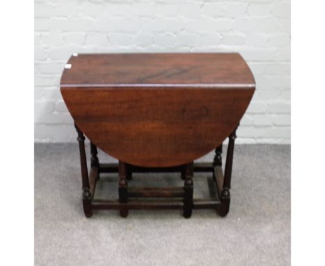 A small late 17th century oak gate leg table on turned supports, 76cm wide x 68cm high. 