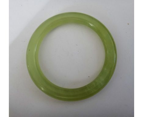 A jade circular bangle, diameter 7cm, internal diameter 5.3cm, weight 34 gms.