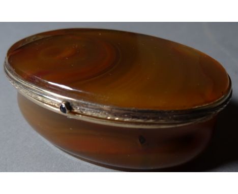 An oval Rococo style brown agate snuff box, (a.f.).  
