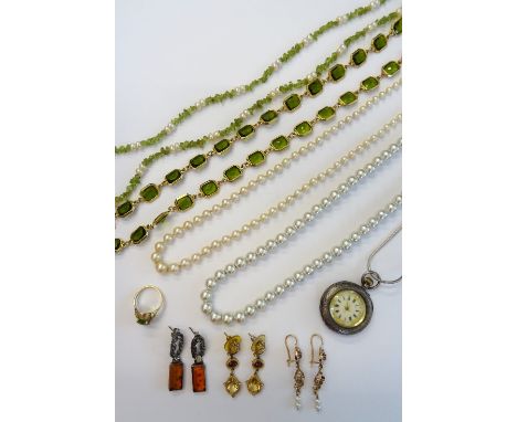 A group of jewellery, comprising; a gold ring, claw set with an oval cut peridot, detailed indistinctly 14 K, a pair of recon