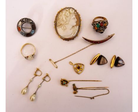 A group of jewellery, comprising; two Victorian stick pins, a gold mounted oval shell cameo brooch, carved as the portrait of