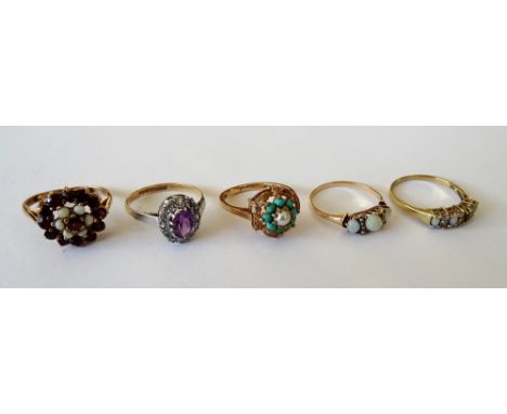 A 9ct gold, garnet and opal cluster ring, a gold ring, set with three oval opals and with two rows of four seed pearls in a s