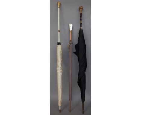A Victorian lady's tortoiseshell and gilt metal mounted umbrella with foliate embossed decoration, 86cm, a burr maple umbrell