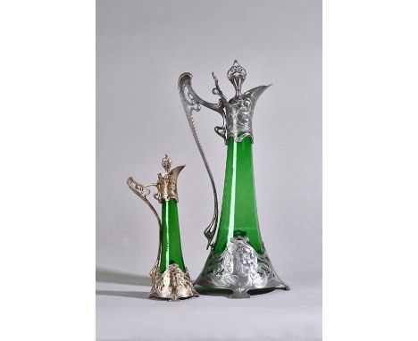 A WMF pewter figural Art Nouveau decanter with hinged stopper and green glass liner stamped maker's marks, circa 1900, 40cm h