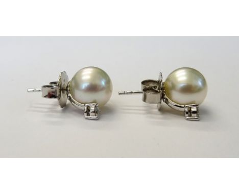 A pair of Mikimoto white gold, cultured pearl and diamond earstuds, each mounted with a cultured pearl above a claw set circu