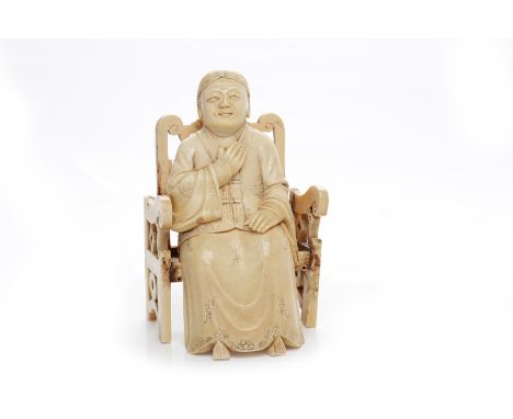 EARLY 20TH CENTURY CHINESE IVORY CARVINGof a man seated on a chair, both pieces signed, 16cm high 