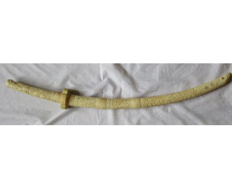 JAPANESE CARVED IVORY KATANAwith curved blade, the handle carved with dragon and with mother of pearl inlay, the sheath carve