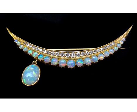 An opal and diamond crescent moon form brooch, set in 15ct yellow gold, the stones arranged in two graduated rows, with singl