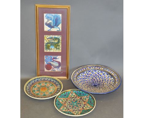 Three prints of glazed ceramic tiles by William de Morgan, framed as one, each 14 x 14cm, together with a large North African