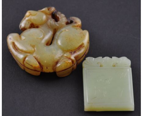 A Chinese jade carving of a horse together with another jade carving