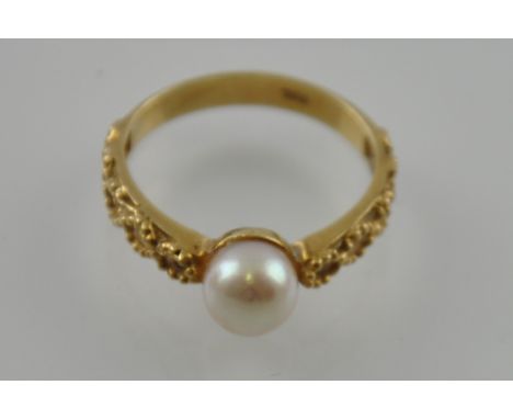 Ladies' 9ct pierced filigree dress ring, set with a pearl