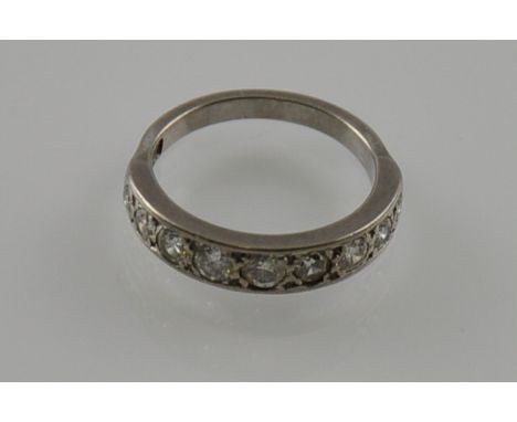 An 18ct white gold and diamond half-eternity ring