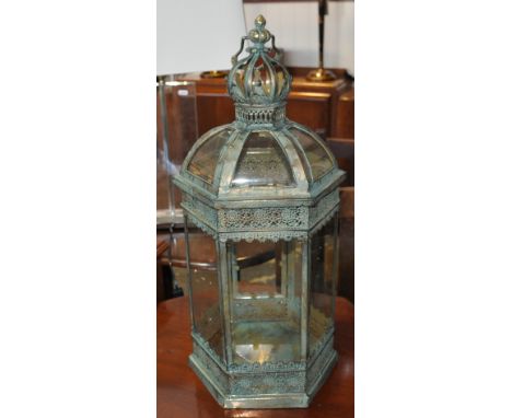 A verdigris metal octagonal glazed garden lantern