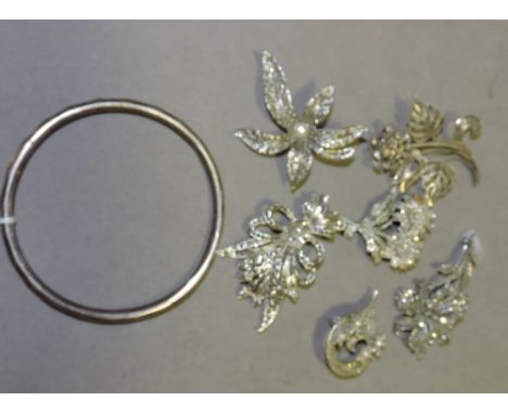 A quantity of silver, silver plated and white metal jewellery, comprising marcasite and filigree brooches, and a slave bangle